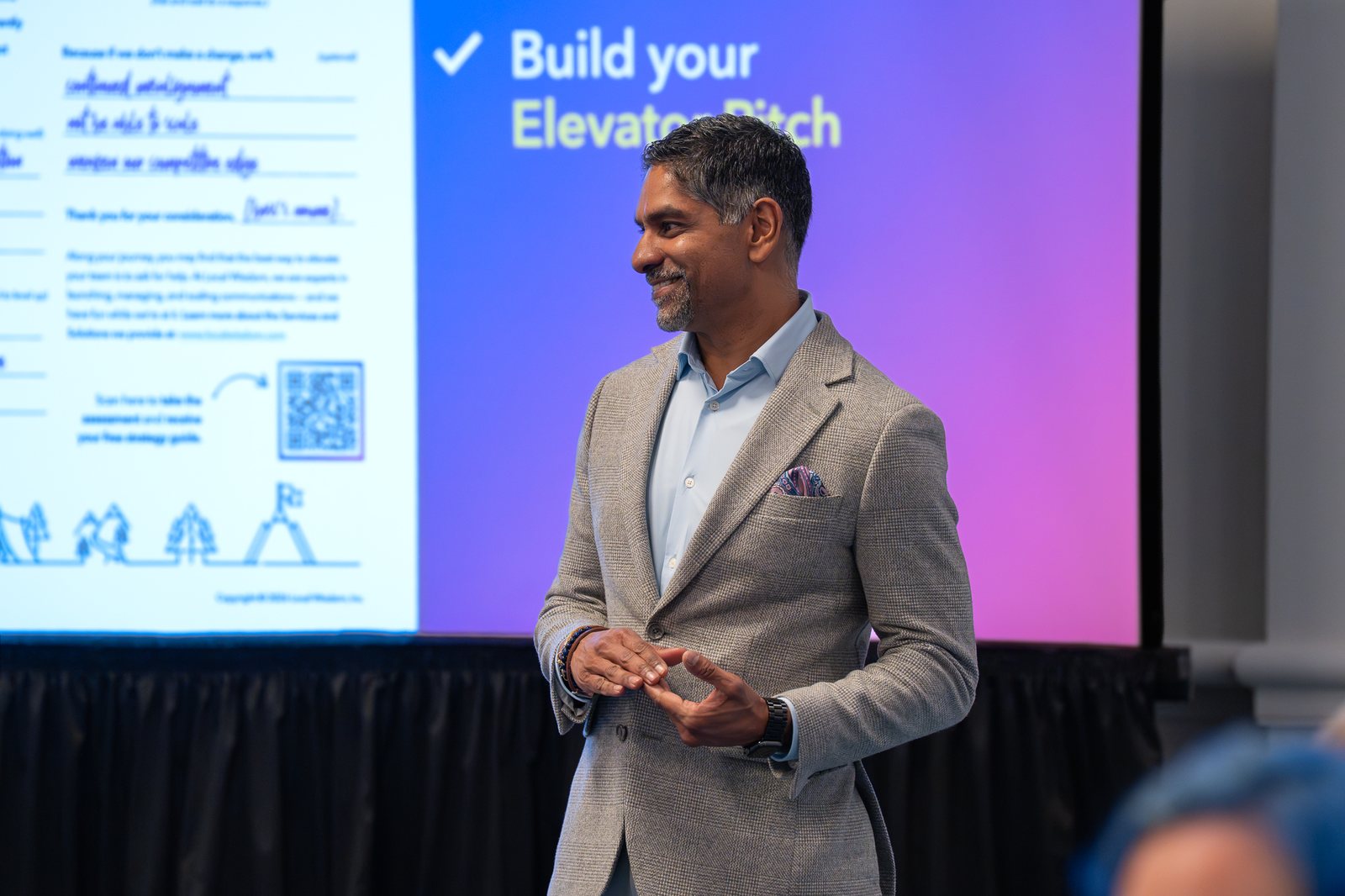 Pinaki Kathiari in front of the Build Your Elevator Pitch slide
