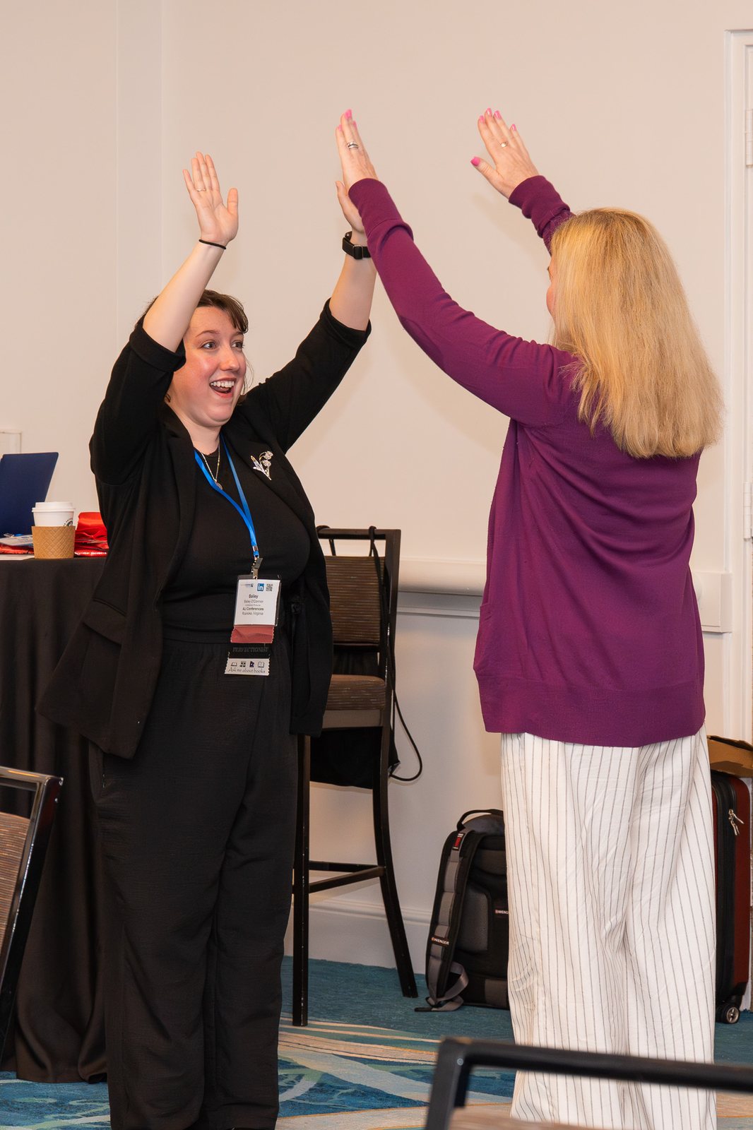 Attendees high-fiving during an exercise
