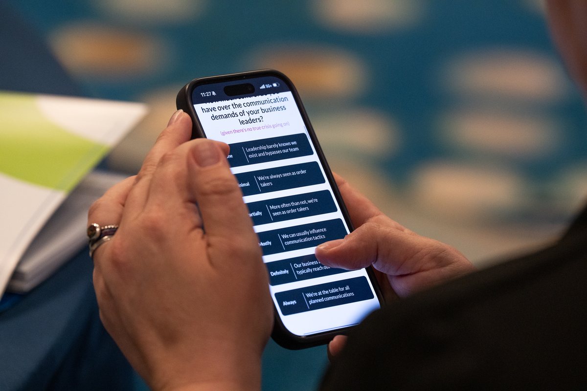 An attendee taking the IC Team Maturity Model assessment on her phone