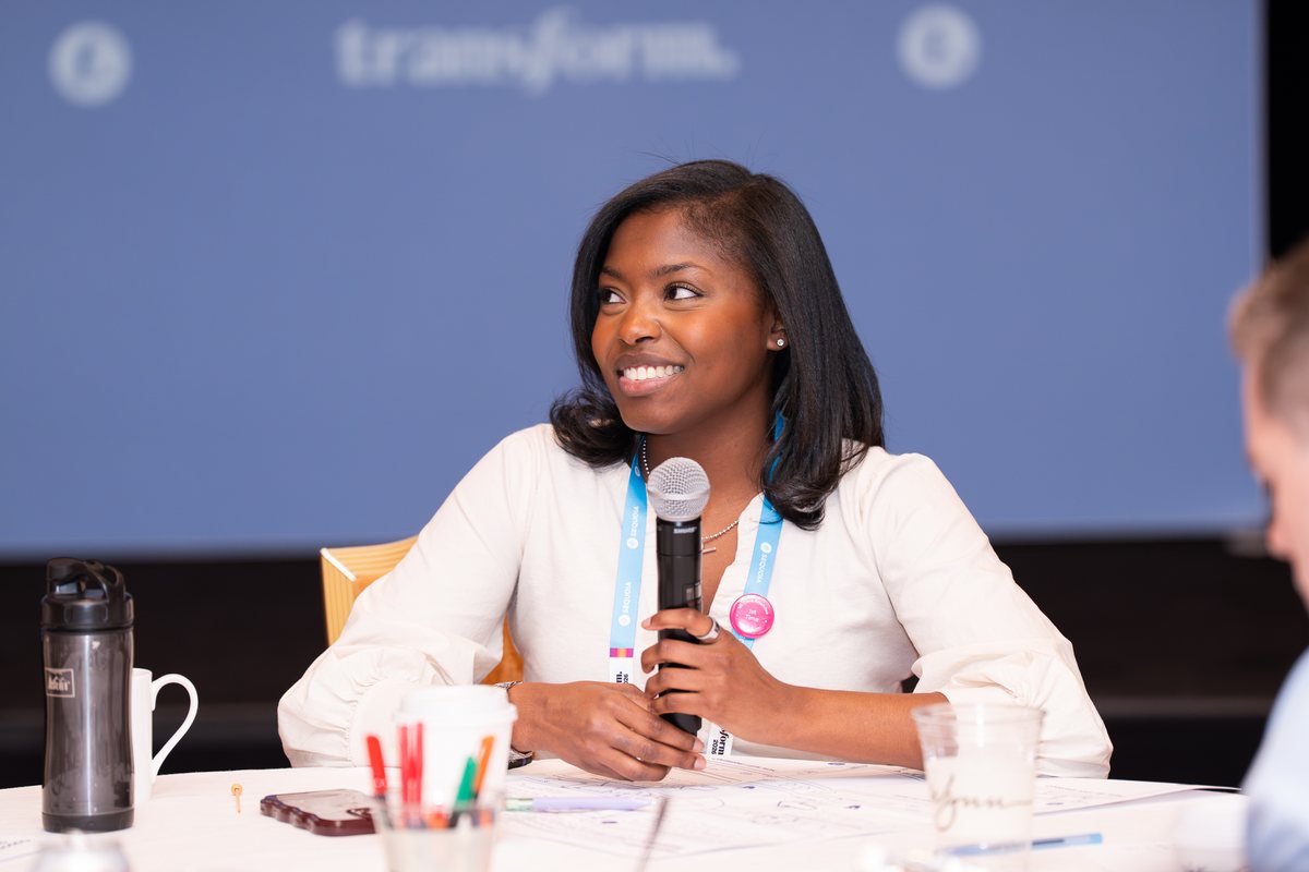 An attendee speaking during table work
