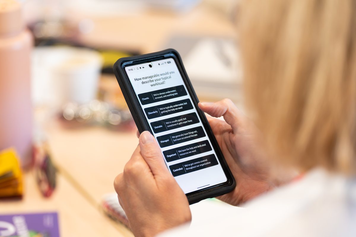 An attendee taking the IC Team Maturity Model assessment on her phone