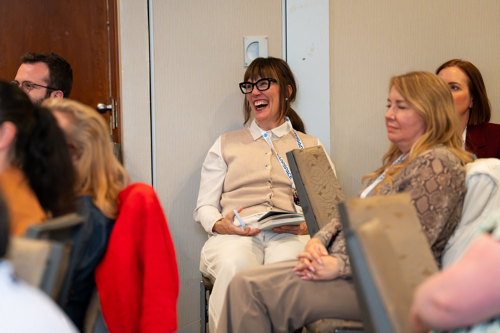 Attendees laughing during the session