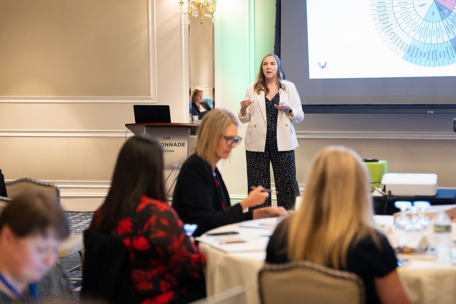 Attendees listening to Kelsey Buckholtz