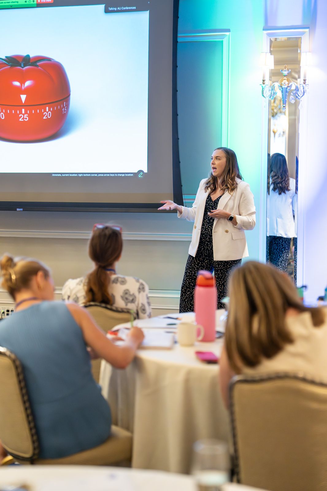 Kelsey Buckholtz speaking with the room