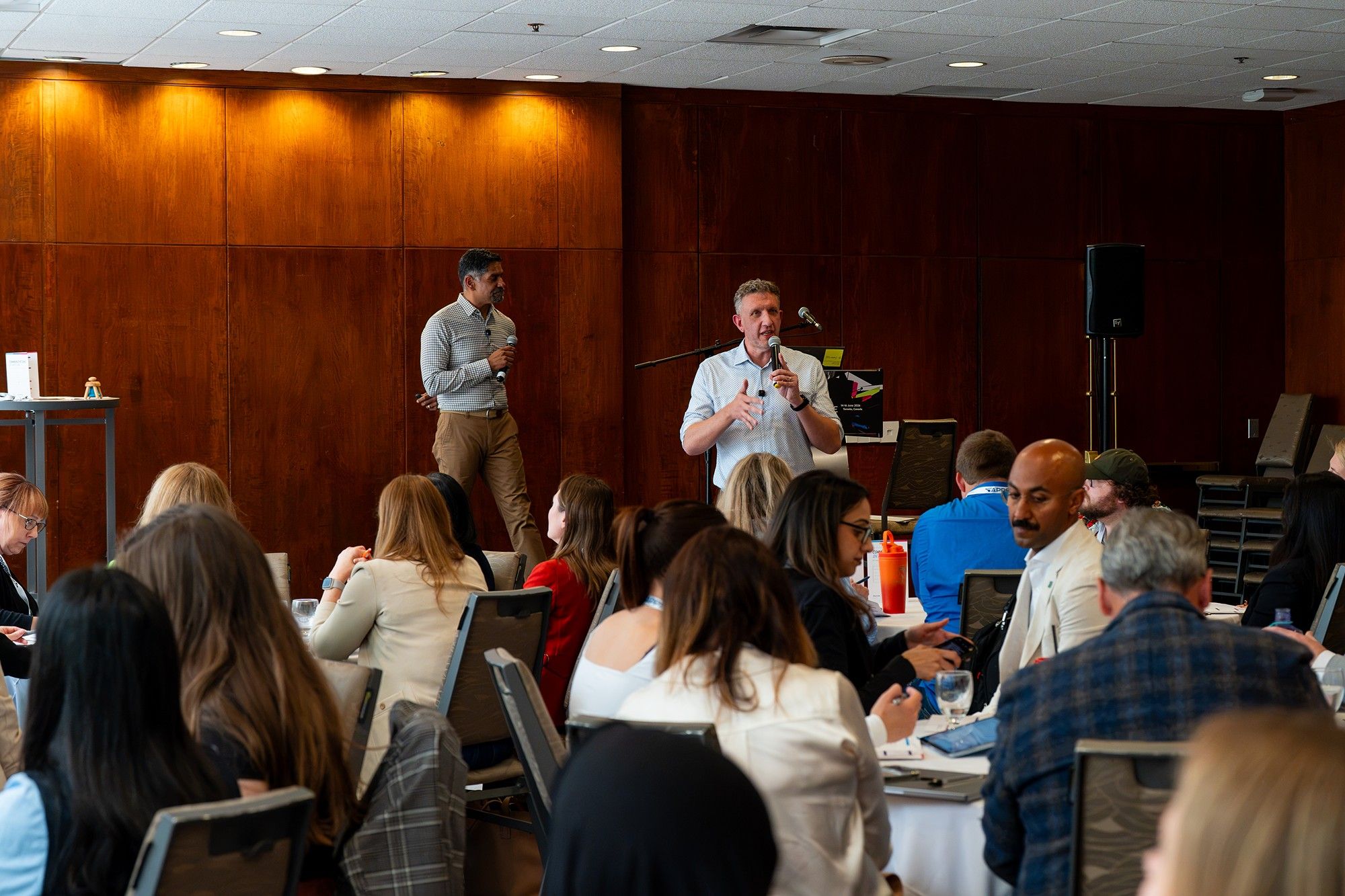 Pinaki Kathiari and Chuck Gose presenting Communications in Motion to a full room at IABC World Conference 2026