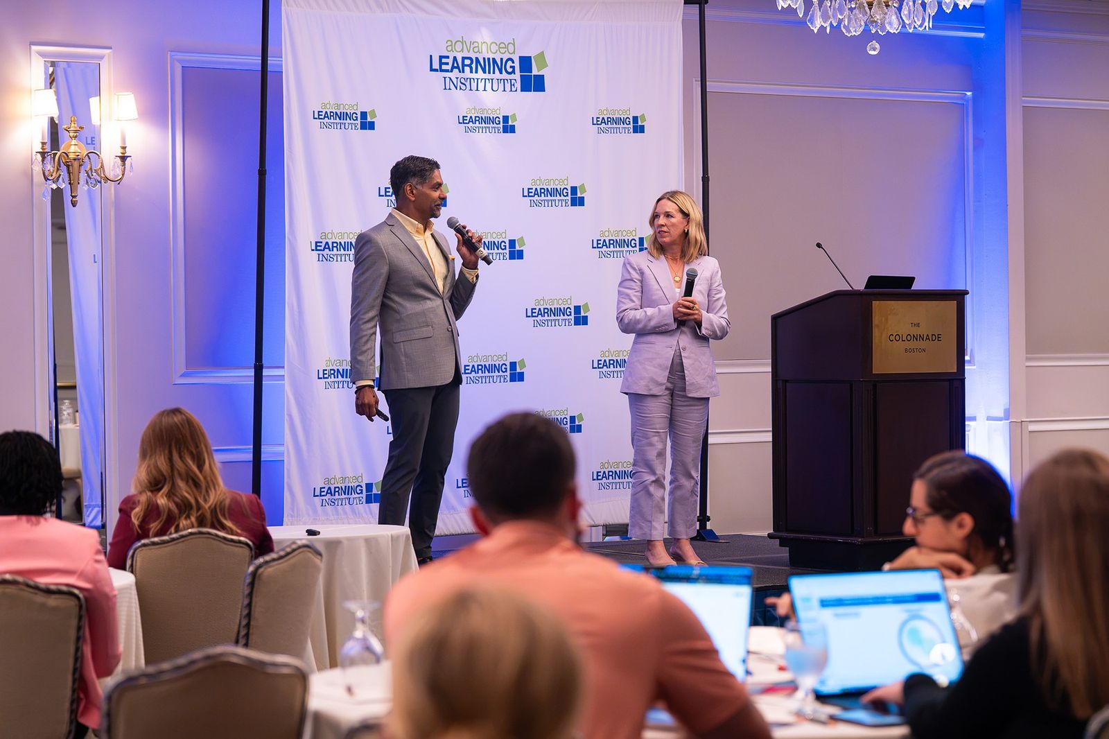 Both presenters with the room