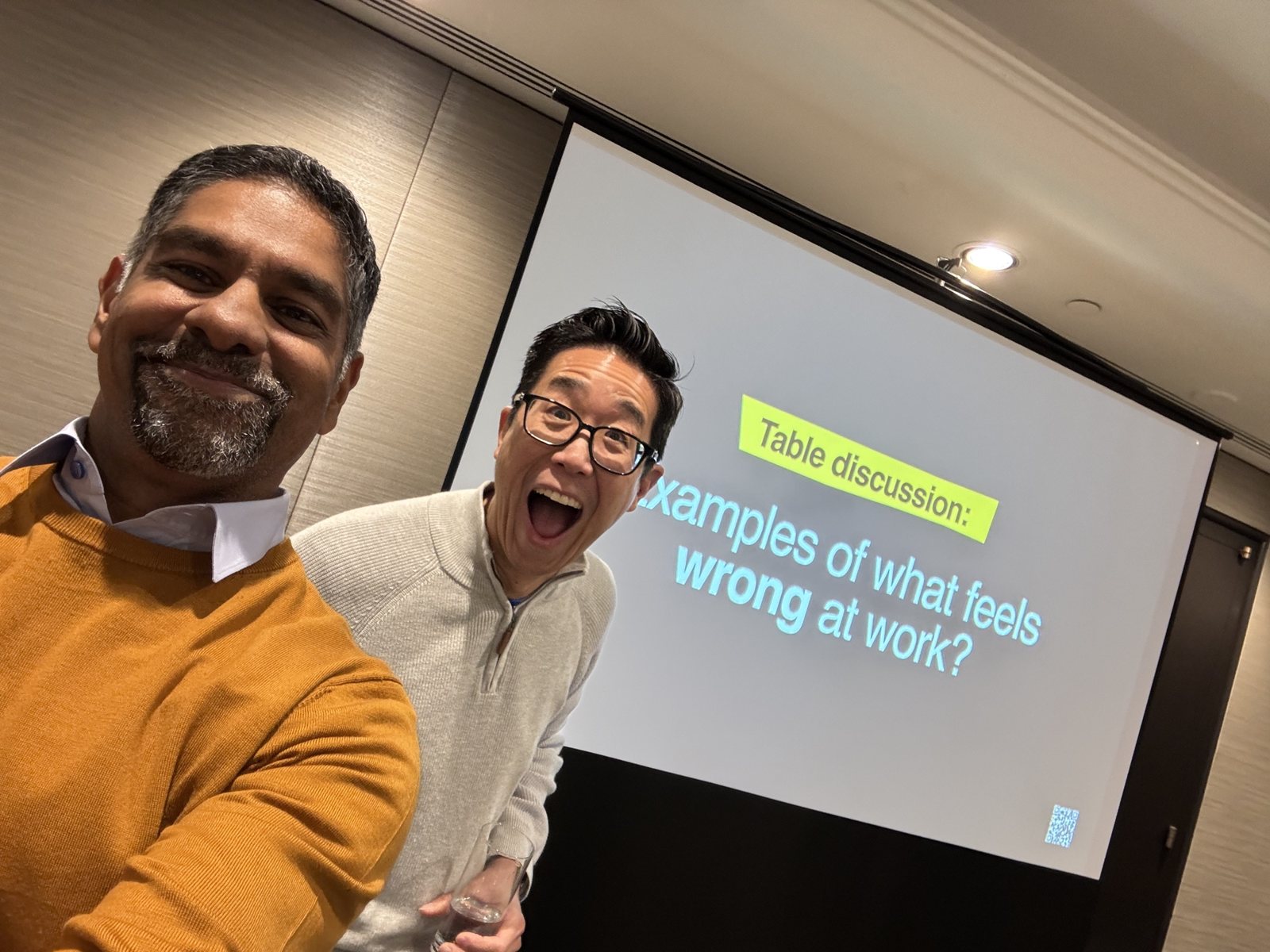 Pinaki Kathiari and Chris Lee in front of the table-discussion slide at ALI Toronto 2024