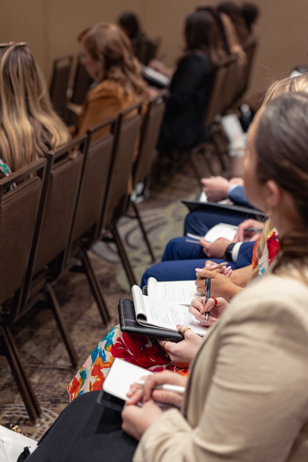Attendees working on their notes