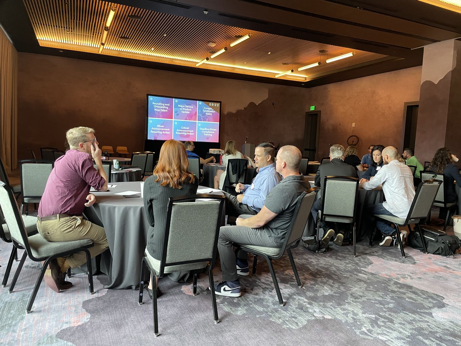 Attendees working at their tables in Denver