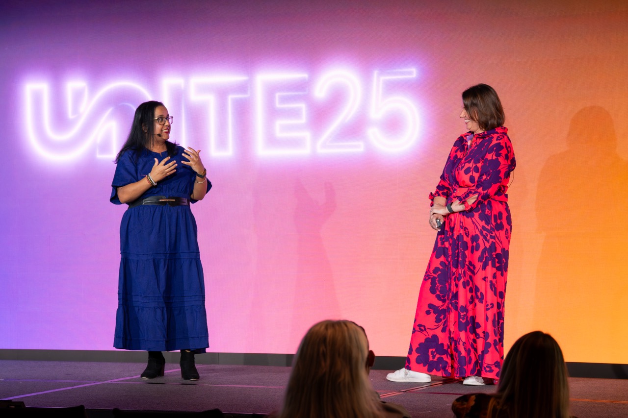 Two speakers on the UNITE 25 stage