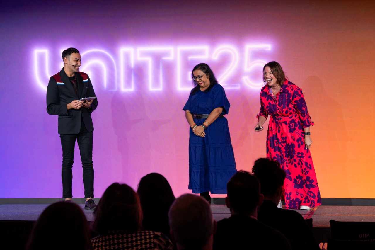 A speaker on stage at Unite 2025